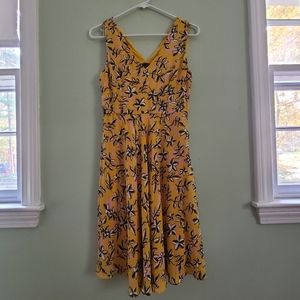Yellow sleeveless pleated dress